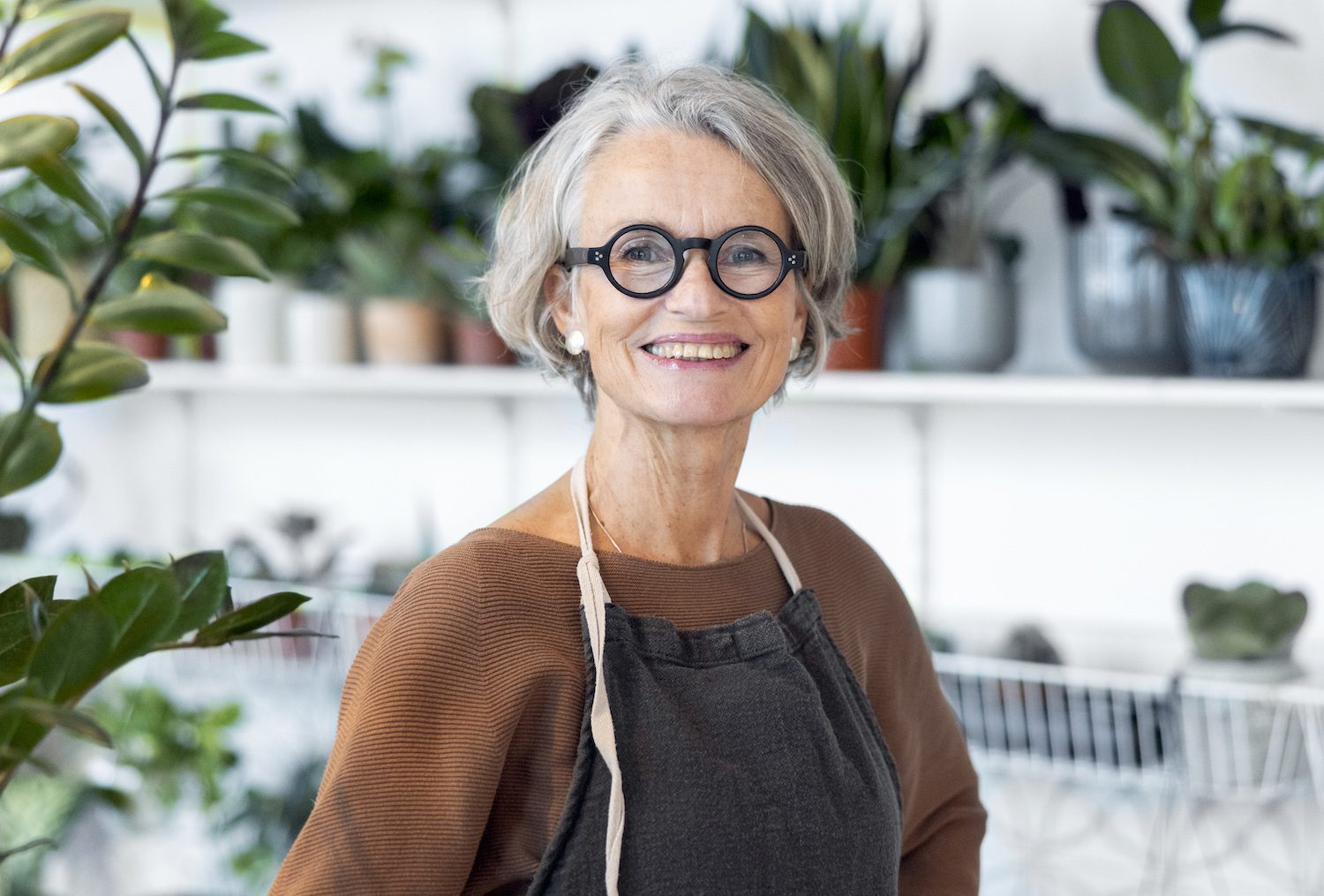 Portrait of senior female florist in her shop