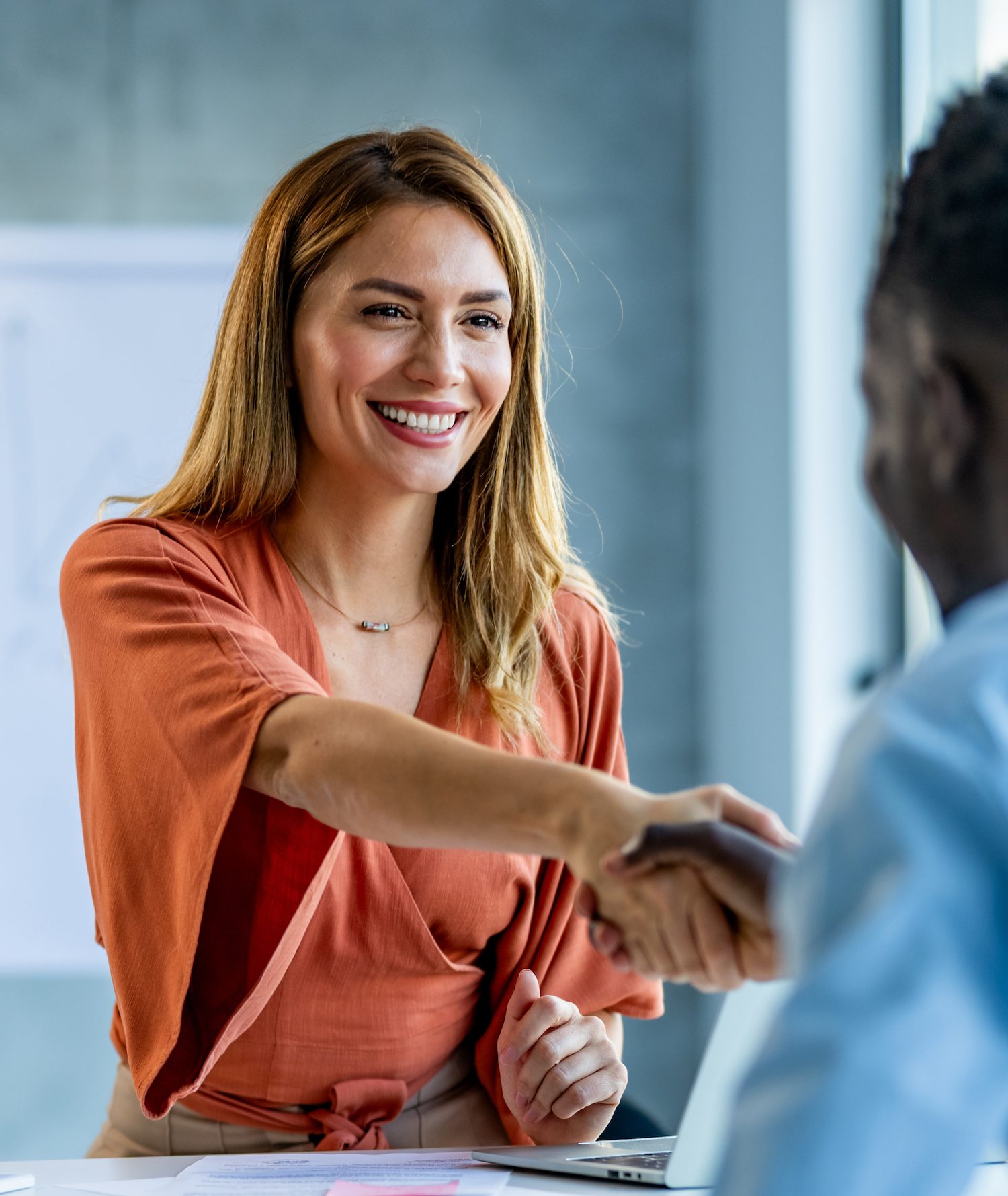 Business people shaking hands in the office.