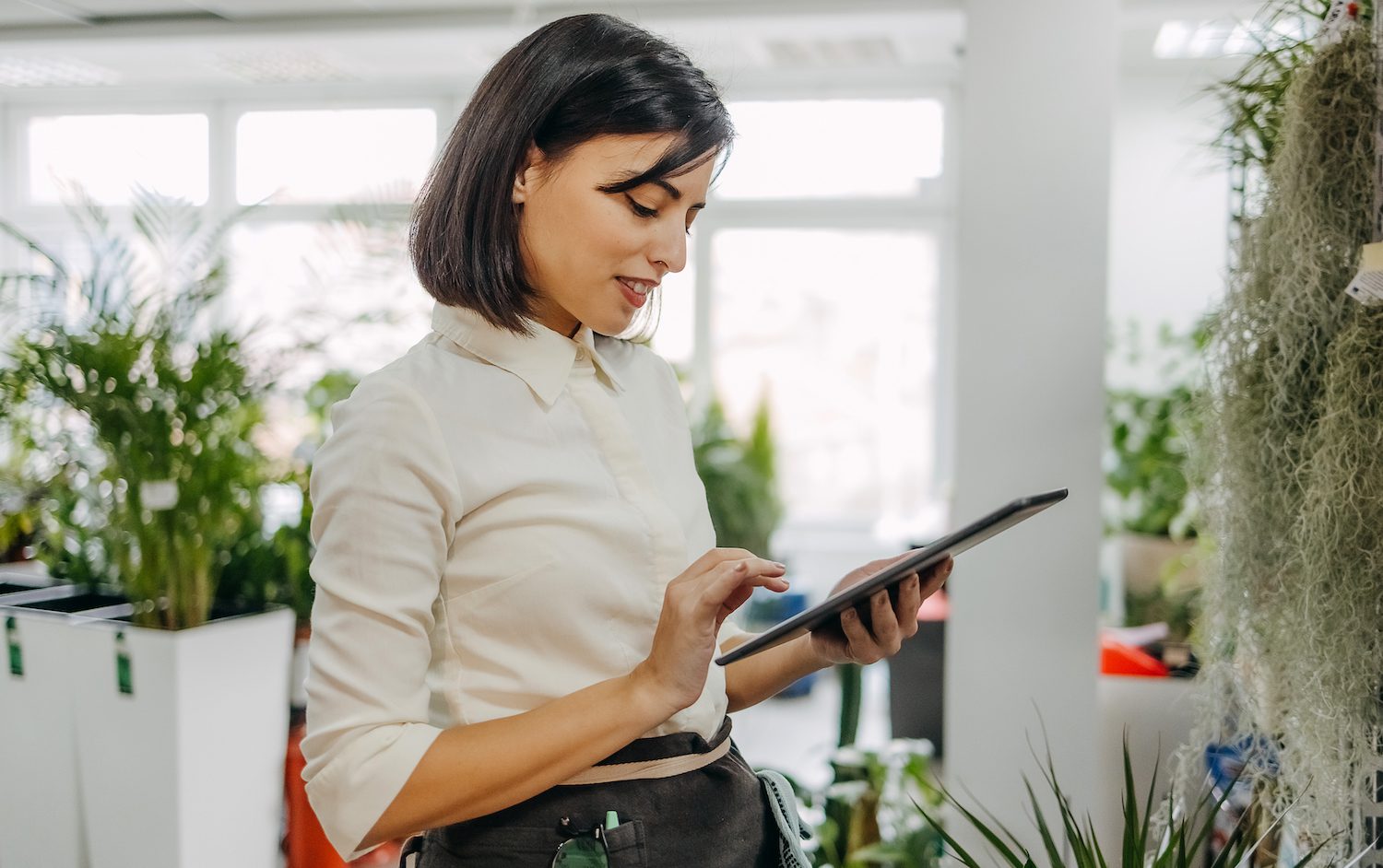 Woman uses a tablet at work